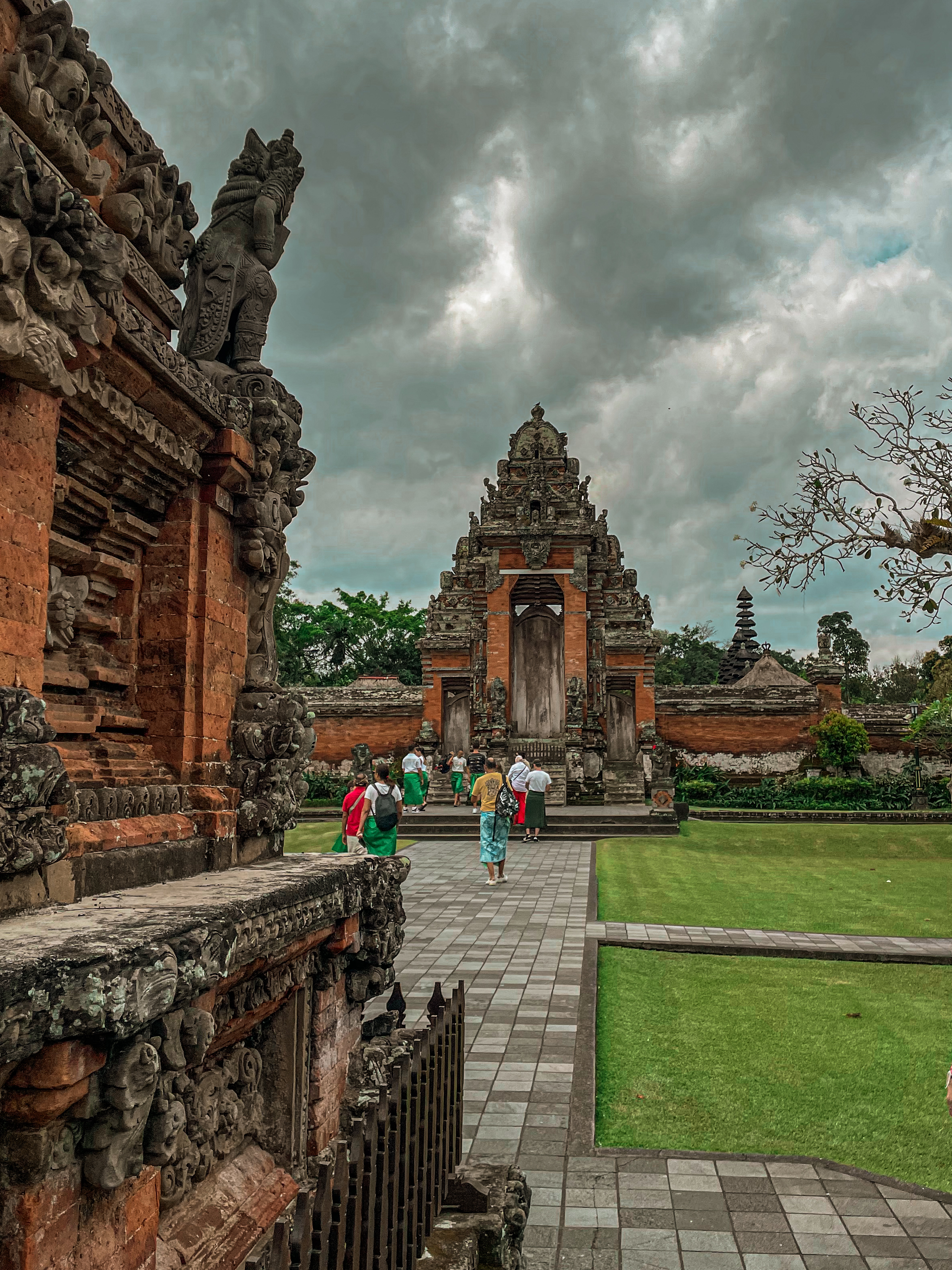 Couple at Taman Ayun Temple entrance in traditional Balinese architecture